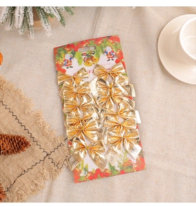 Set of 12 gold glitter Christmas bows for tree decoration on a festive red backing card