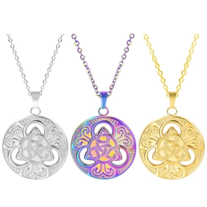 Detailed close-up of Triquetra knot charms in silver, gold, and rainbow finish