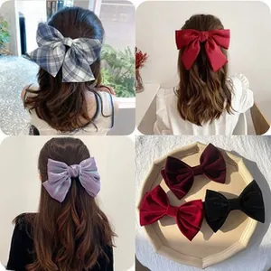 Detail of velvet and satin bow hair clips in various colors for elegant hairstyles