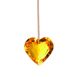 Yellow heart crystal suncatcher pendant with multi-faceted cut on white background