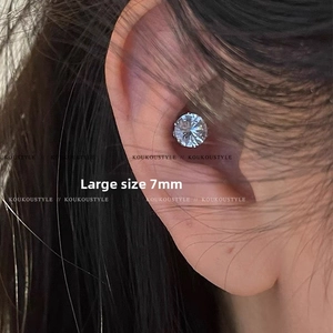 Close-up of a 7mm large zircon magnetic ear cuff worn on the conch of the ear
