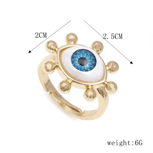 Macro detail of gold-plated geometric evil eye ring showing dimensions 2.5cm by 2cm
