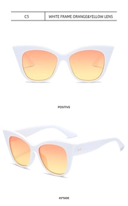 Cat eye white frame sunglasses with orange gradient lenses and gold dot details