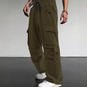 Men's olive green parachute cargo pants with loose fit and drawstring waist for casual wear