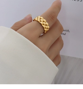 Detailed macro view of 18k gold plated stainless steel watch-link chain ring for women