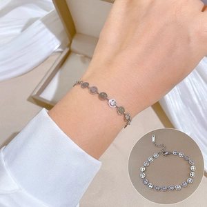 Minimalist titanium steel chain bracelet with cutout smiley face charms in silver finish