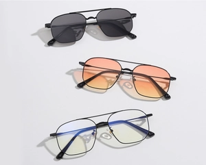 Detail of metal aviator sunglasses showing 62058 model number and CE mark on the temple