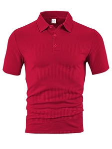 Close-up of the woven jacquard fabric texture and neck label on a red men's polo shirt