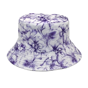 Detail of purple floral pattern on white bucket hat with fine parallel stitching edge