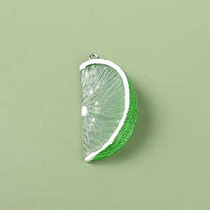 Detailed view of a realistic green resin lemon slice charm with clear fruit pulp texture