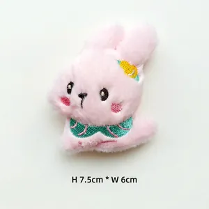 Detail view of pink plush rabbit patch with floral bow, size 7.5cm by 6cm