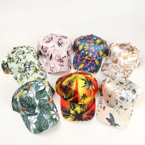 Detailed collection of satin baseball caps featuring colorful tropical palm and floral prints