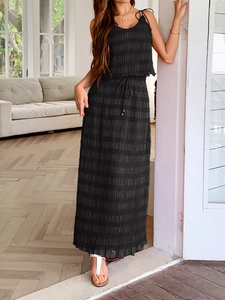 Detail of black textured two-piece vacation set showing tie-strap top and drawstring skirt
