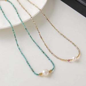 Elegant beaded necklace with turquoise stones and a single central white pearl for women