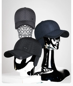 Detail of winter baseball cap with quilted texture and foldable ear protection flaps