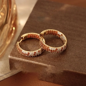 Retro round gold hoop earrings with orange and white pavé cubic zirconia gemstones