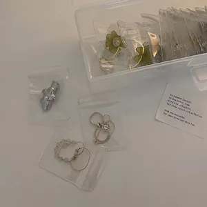 Portable clear jewelry organizer box with anti-oxidation PE film bags for earrings