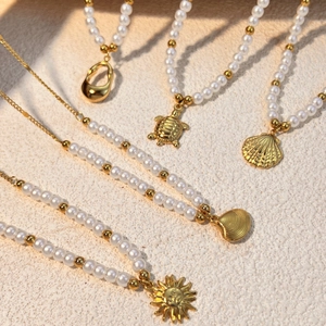 Elegant gold stainless steel pearl necklaces with sun, sea turtle, and shell pendants