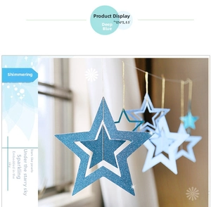 Close-up of blue hollow glitter star hanging ornaments with nested 3D five-point star design