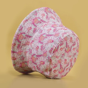 Pink daisy print reversible bucket hat with flat top and wide stitched brim for women
