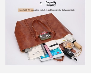 Interior view of brown vintage tote bag showing large capacity for A4 magazines and tablets