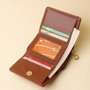 Brown bi-fold short wallet for women featuring multiple card slots and a zipper pocket
