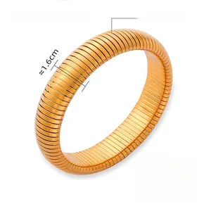 Detail of 1.6cm wide golden titanium steel Tubogas bracelet with spiral snake texture