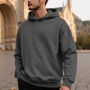 Men's dark grey pullover hoodie featuring premium textured geometric knit fabric