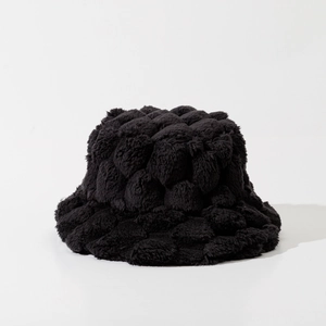 Close-up of black plush bucket hat featuring a 3D bubble texture and soft furry material