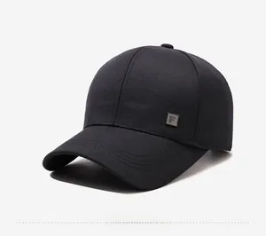 Detail view of black baseball cap featuring a square metal F logo and reinforced stitching