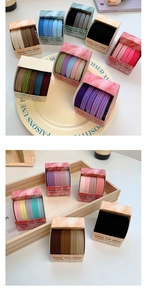 Macro detail of high elasticity candy colored hair bands in elegant box packaging