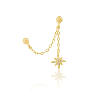 Detailed shot of golden sterling silver chain earring with zircon star pendant