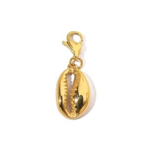 Detailed view of a golden cowrie shell pendant with a metallic lobster clasp closure