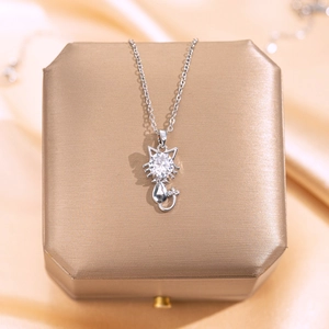 Silver kitten pendant necklace featuring a large round zircon stone on a cross chain