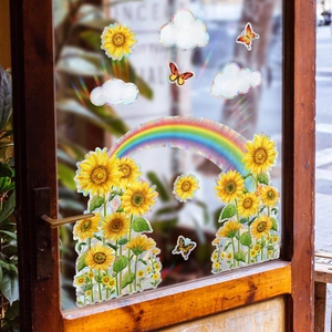 Rainbow holographic window stickers with sunflowers and butterflies on a glass door