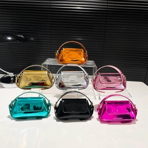 Fashionable mini glossy patent leather shoulder bags in various metallic vibrant colors