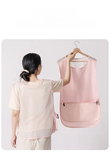 Detail view of pink mesh kitchen apron featuring breathable back and side buckles
