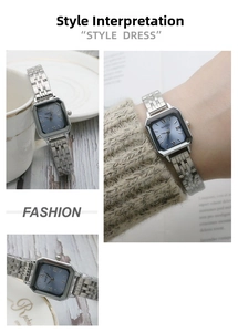 Detail of square quartz watch with blue sunray dial and silver stainless steel band