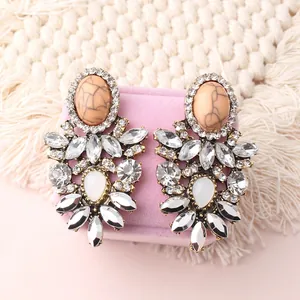 Chic gold-tone flower statement earrings with clear crystals and opalescent stones