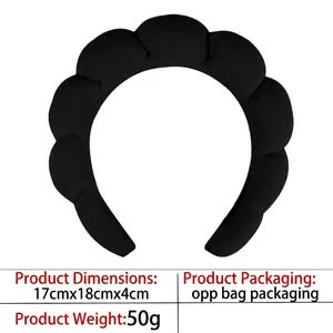Close-up of fluffy black headband measuring 17x18x4cm with soft sponge knit fabric