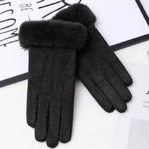 Detail of black suede gloves with plush cuffs and touch screen compatible fingertips