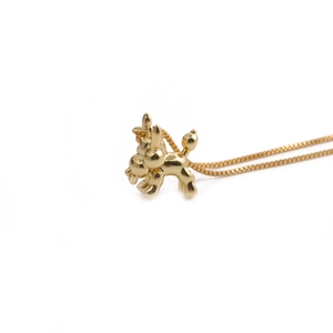 Minimalist gold balloon dog pendant necklace on a sleek box chain, professional white background