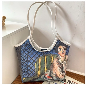 Artistic oil painting canvas tote bag detail on wood table with newsprint backdrop