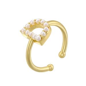 Detailed close-up of golden adjustable ring featuring a letter D inlaid with small pearls