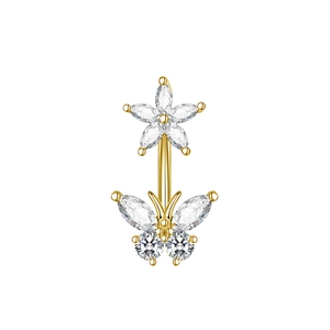 Macro detail of golden butterfly belly ring with sparkling marquise zircon stones