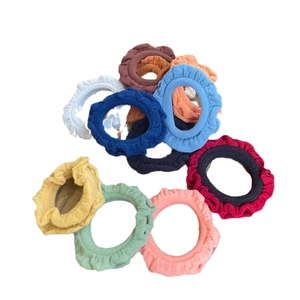 Set of 9 colorful ruffle fabric hair scrunchies in minimalist candy colors on white background
