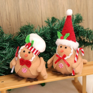 Christmas gingerbread birds decorations on wood with pine needles for tree holiday decor