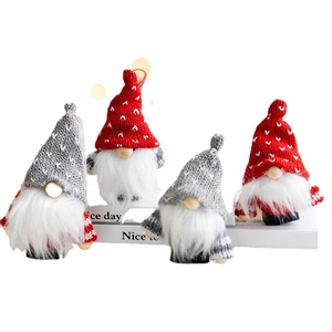 Set of four handmade Christmas gnomes with heart embroidery and long white beards