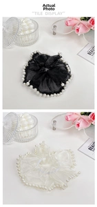 Close-up of black and beige mesh scrunchies with elegant pearl edges in tile display