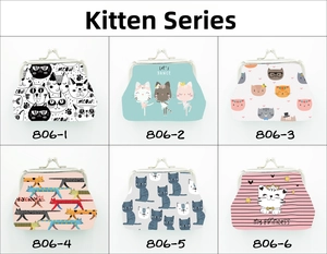 Close-up of six mini canvas clasp purses featuring diverse cute cartoon cat patterns